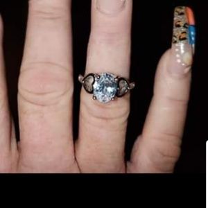 Silver diamond ring with hearts